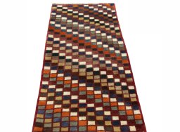 Surface texture of 2000s Persian Gabbeh rug with natural Wool and intricate pattern