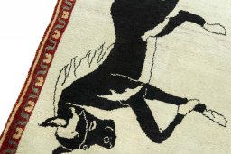 Backside of handmade 2000s Persian Gabbeh rug showing knot structure and weave density
