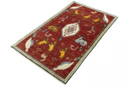 Corner detail of 2000s Persian Gabbeh rug showing border pattern and Wool pile