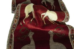 Corner detail of 2000s Persian Gabbeh rug showing border pattern and Wool pile