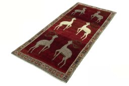 Corner detail of 2000s Persian Gabbeh rug showing border pattern and Wool pile