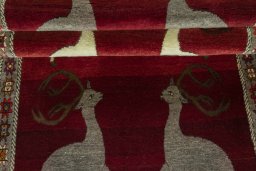Full view of 2000s Persian Gabbeh rug from Iran / Persia, 235 × 110 cm in Red tones