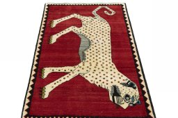 Surface texture of 2000s Persian Gabbeh rug with natural Wool and intricate pattern