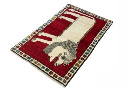 Corner detail of 2000s Persian Gabbeh rug showing border pattern and Wool pile