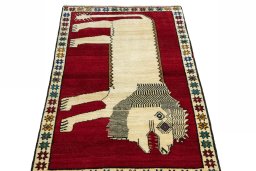 Surface texture of 2000s Persian Gabbeh rug with natural Wool and intricate pattern
