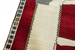 Backside of handmade 2000s Persian Gabbeh rug showing knot structure and weave density