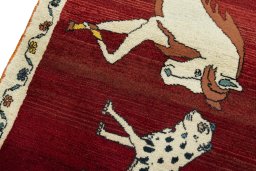 Backside of handmade 2000s Persian Gabbeh rug showing knot structure and weave density