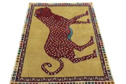 Surface texture of 2000s Persian Gabbeh rug with natural Wool and intricate pattern
