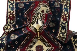 Corner detail of 2000s Persian Gabbeh rug showing border pattern and Wool pile