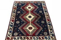 Surface texture of 2000s Persian Gabbeh rug with natural Wool and intricate pattern