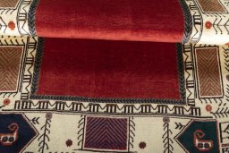 Corner detail of 2000s Persian Gabbeh rug showing border pattern and Wool pile