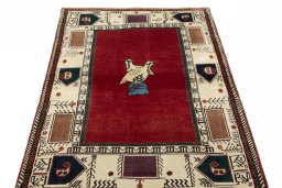 Surface texture of 2000s Persian Gabbeh rug with natural Wool and intricate pattern