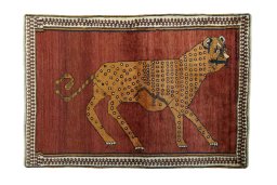 Full view of 1970s Persian Gabbeh rug from Iran / Persia, 180 × 122 cm in Red tones