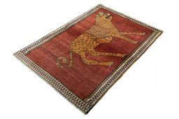 Corner detail of 1970s Persian Gabbeh rug showing border pattern and Wool pile