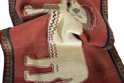 Corner detail of 2000s Persian Gabbeh rug showing border pattern and Wool pile