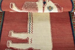 Full view of 2000s Persian Gabbeh rug from Iran / Persia, 151 × 106 cm in Red tones