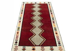 Surface texture of 2000s Persian Gabbeh rug with natural Wool and intricate pattern