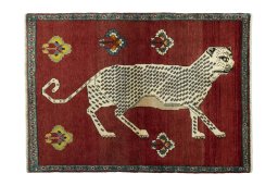 Full view of 2000s Persian Gabbeh rug from Iran / Persia, 188 × 135 cm in Red tones