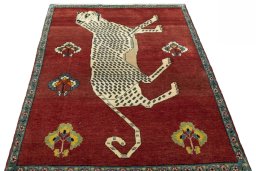 Surface texture of 2000s Persian Gabbeh rug with natural Wool and intricate pattern