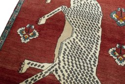 Backside of handmade 2000s Persian Gabbeh rug showing knot structure and weave density