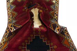Corner detail of 2000s Persian Gabbeh rug showing border pattern and Wool pile