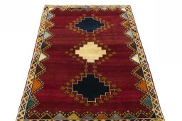 Surface texture of 2000s Persian Gabbeh rug with natural Wool and intricate pattern