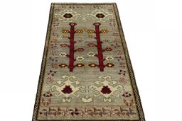 Surface texture of 2000s Persian Gabbeh rug with natural Wool and intricate pattern