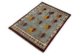Corner detail of 2000s Persian Gabbeh rug showing border pattern and Wool pile