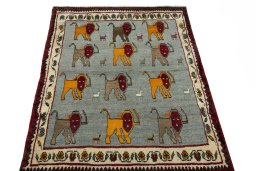 Surface texture of 2000s Persian Gabbeh rug with natural Wool and intricate pattern