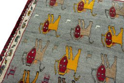 Backside of handmade 2000s Persian Gabbeh rug showing knot structure and weave density