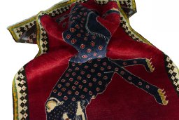 Corner detail of 2000s Persian Gabbeh rug showing border pattern and Wool pile