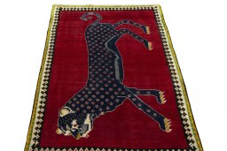 Surface texture of 2000s Persian Gabbeh rug with natural Wool and intricate pattern