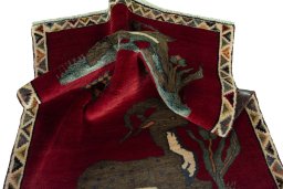 Corner detail of 2000s Persian Gabbeh rug showing border pattern and Wool pile
