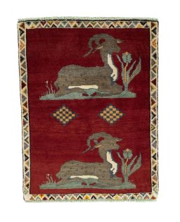 Full view of 2000s Persian Gabbeh rug from Iran / Persia, 128 × 100 cm in Red tones