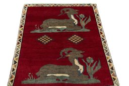 Surface texture of 2000s Persian Gabbeh rug with natural Wool and intricate pattern