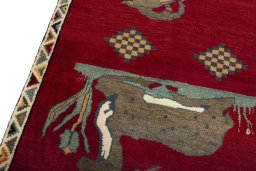 Backside of handmade 2000s Persian Gabbeh rug showing knot structure and weave density