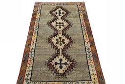 Surface texture of 2000s Persian Gabbeh rug with natural Wool and intricate pattern