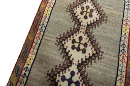 Backside of handmade 2000s Persian Gabbeh rug showing knot structure and weave density