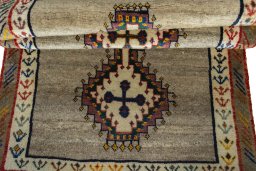 Full view of 2000s Persian Gabbeh rug from Iran / Persia, 174 × 100 cm in Beige tones