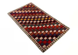Close-up detail of 2000s Persian Gabbeh rug from Iran / Persia showing Wool weave