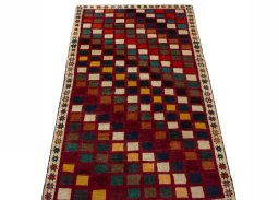 Surface texture of 2000s Persian Gabbeh rug with natural Wool and intricate pattern
