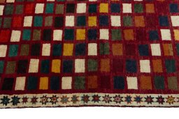 Close-up detail of 2000s Persian Gabbeh rug from Iran / Persia showing Wool weave