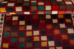 Full view of 2000s Persian Gabbeh rug from Iran / Persia, 149 × 86 cm in Multi Color tones