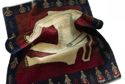 Corner detail of 2000s Persian Gabbeh rug showing border pattern and Wool pile