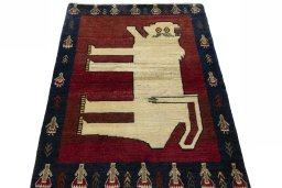 Surface texture of 2000s Persian Gabbeh rug with natural Wool and intricate pattern