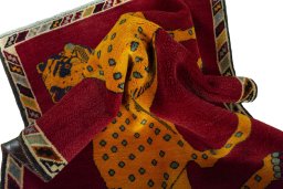 Corner detail of 2000s Persian Gabbeh rug showing border pattern and Wool pile