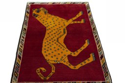Surface texture of 2000s Persian Gabbeh rug with natural Wool and intricate pattern