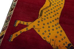 Backside of handmade 2000s Persian Gabbeh rug showing knot structure and weave density