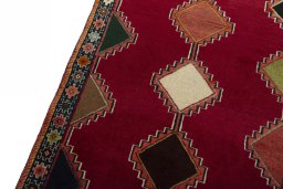Backside of handmade 2000s Persian Gabbeh rug showing knot structure and weave density