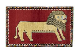 Full view of 2000s Persian Gabbeh rug from Iran / Persia, 178 × 109 cm in Red tones